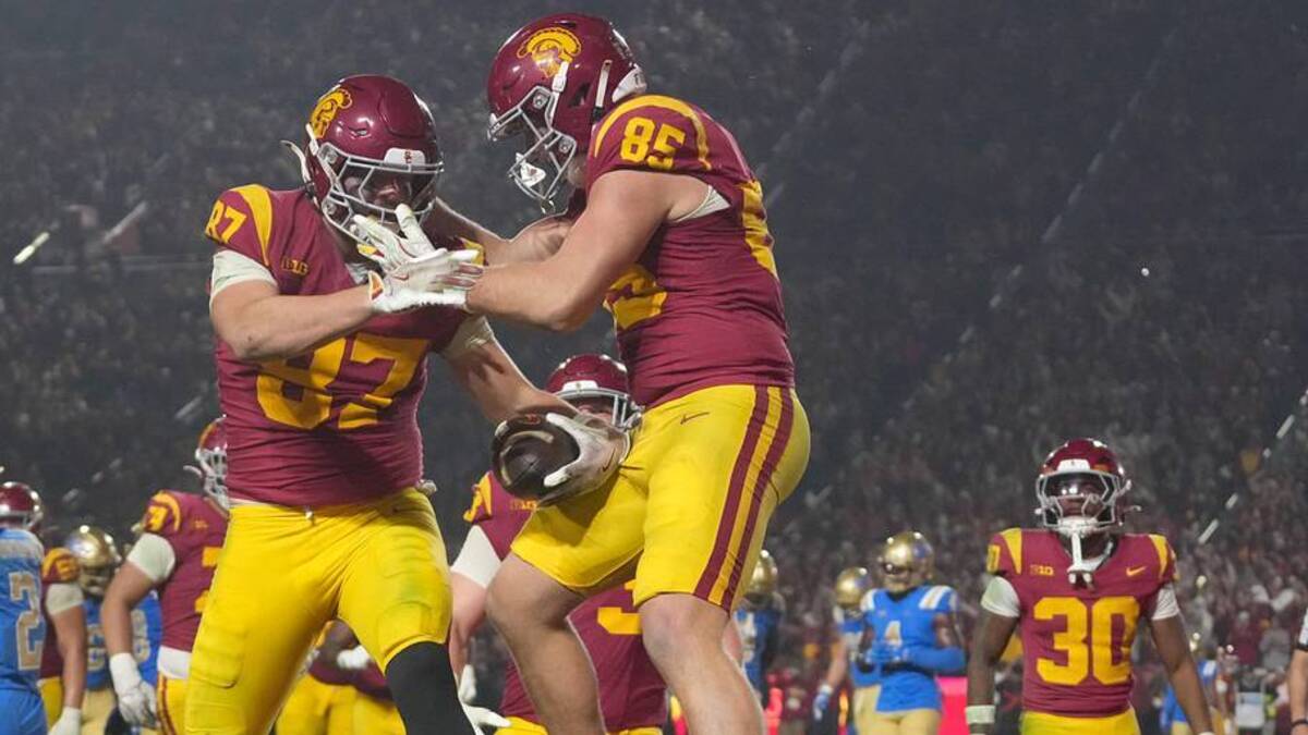  Nov 29, 2025; Los Angeles, California, USA; Southern California Trojans tight end Lake McRee (87) celebrates with tight end Walker Lyons (85) after catching a 2-yard touchdown pass against the UCLA Bruins in the second half at United Airlines Field at Los Angeles Memorial Coliseum. Mandatory Credit: Kirby Lee-Imagn Images | Kirby Lee-Imagn Images 