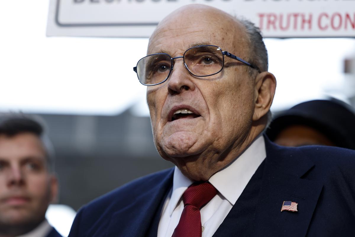  WASHINGTON, DC – DECEMBER 15: Rudy Giuliani, the former personal lawyer for former U.S. President Donald Trump, speaks with reporters outside of the E. Barrett Prettyman U.S. District Courthouse after a verdict was reached in his defamation jury trial on December 15, 2023 in Washington, DC. A jury has ordered Giuliani to pay $148 million in damages to Fulton County election workers Ruby Freeman and Shaye Moss. (Photo by Anna Moneymaker/Getty Images) 
