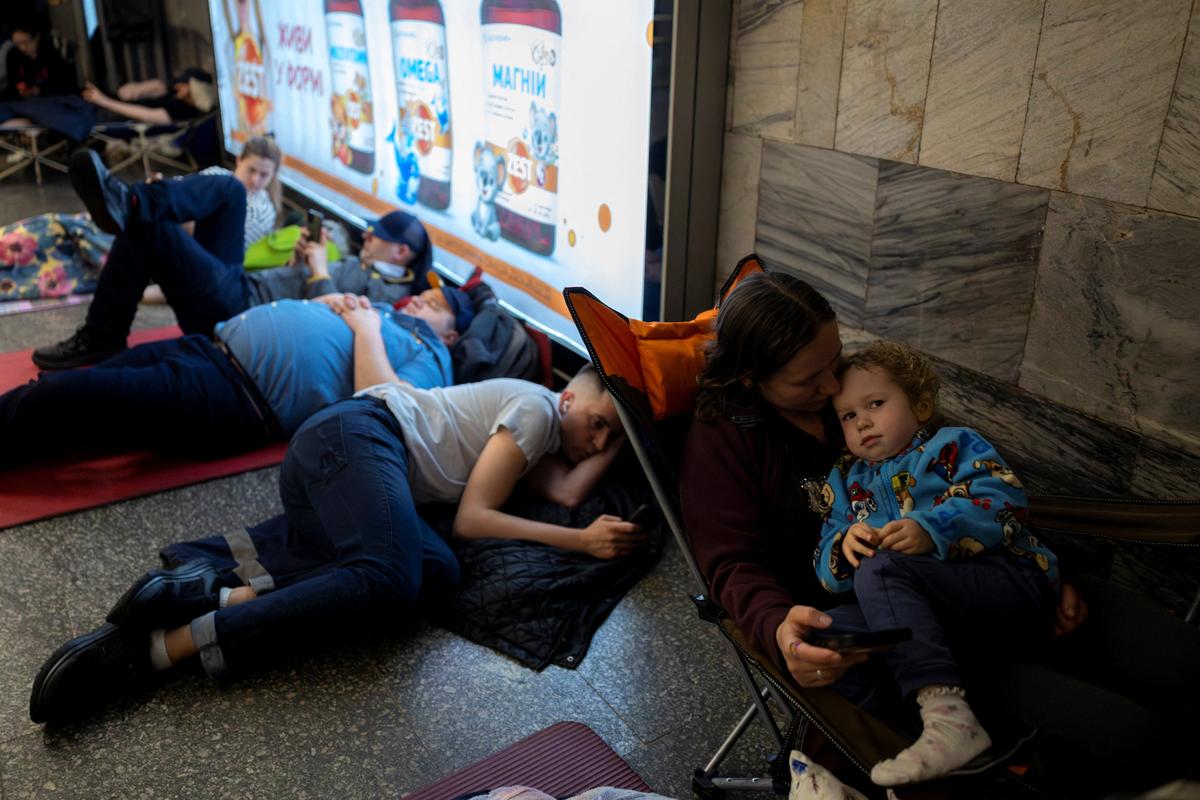 People shelter in a metro station during Russian missile and drone attacks, amid Russia's attack on Ukraine, in Kyiv, Ukraine May 24, 2026. REUTERS/Thomas Peter