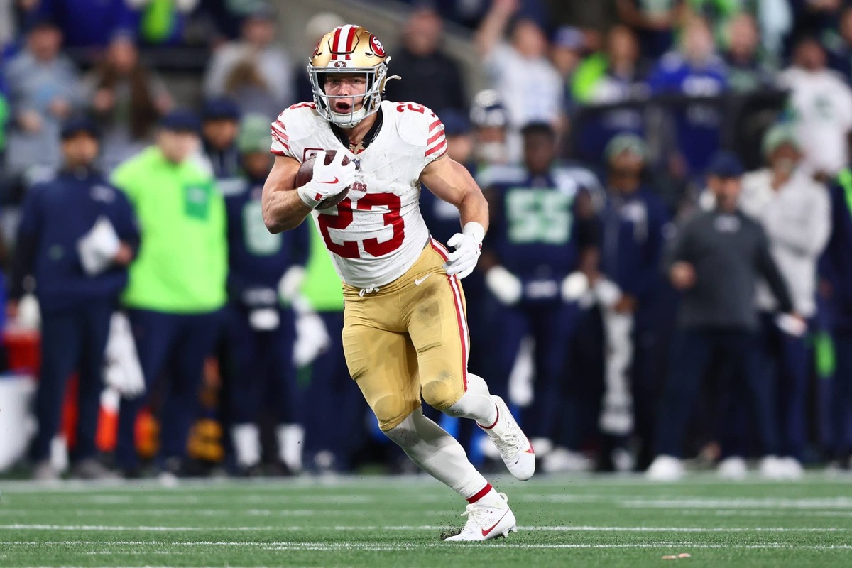  San Francisco 49ers running back Christian McCaffrey runs after the catch against the Seattle Seahawks during an NFC Divisional Round game at Lumen Field. Kevin Ng-Imagn Images
