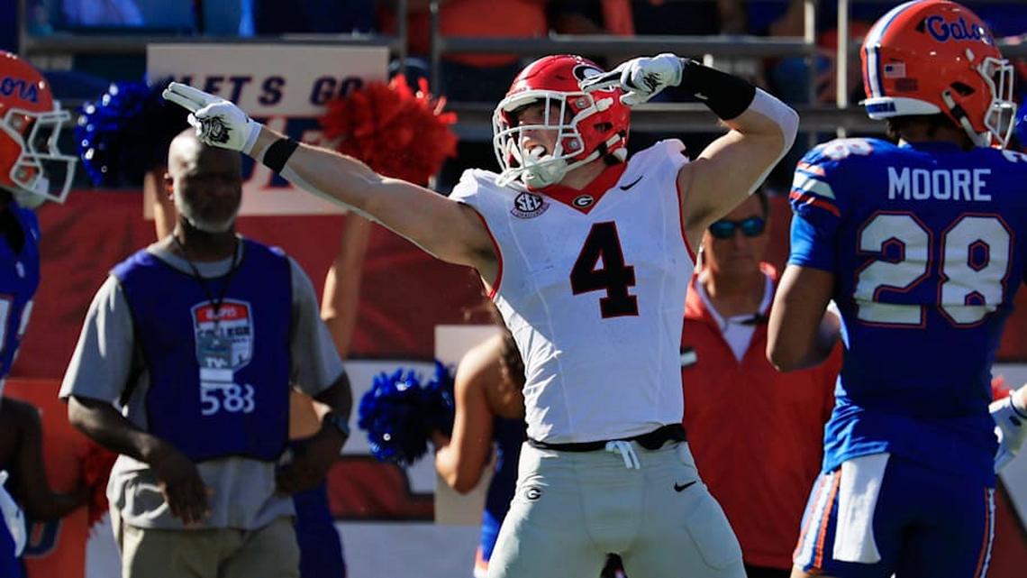  Georgia Bulldogs tight end Oscar Delp (4) indicates a first down pickup during the first quarter of an NCAA football game, Saturday, Nov. 1, 2025, at EverBank Stadium in Jacksonville, Fla. Georgia held off Florida 24-20. [Corey Perrine/Florida Times-Union] | Corey Perrine/Florida Times-Union / USA TODAY NETWORK via Imagn Images 