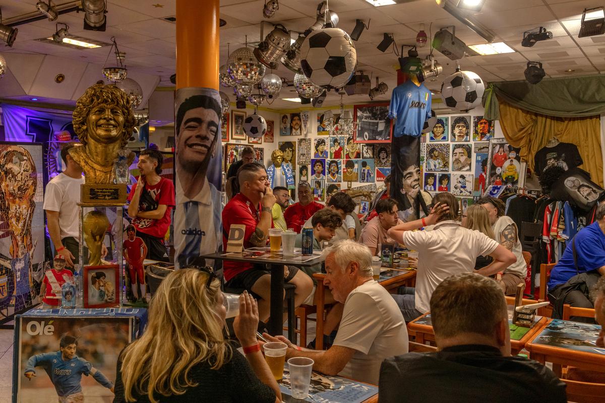 Fans of the Argentinos Juniors soccer team gather in a restaurant ahead of a weekend game on April 18, 2026. Dynamic ticket pricing has made this year's World Cup tournament the most expensive in history, pushing Argentine fans to extremes. (Sarah Pabst/The New York Times)