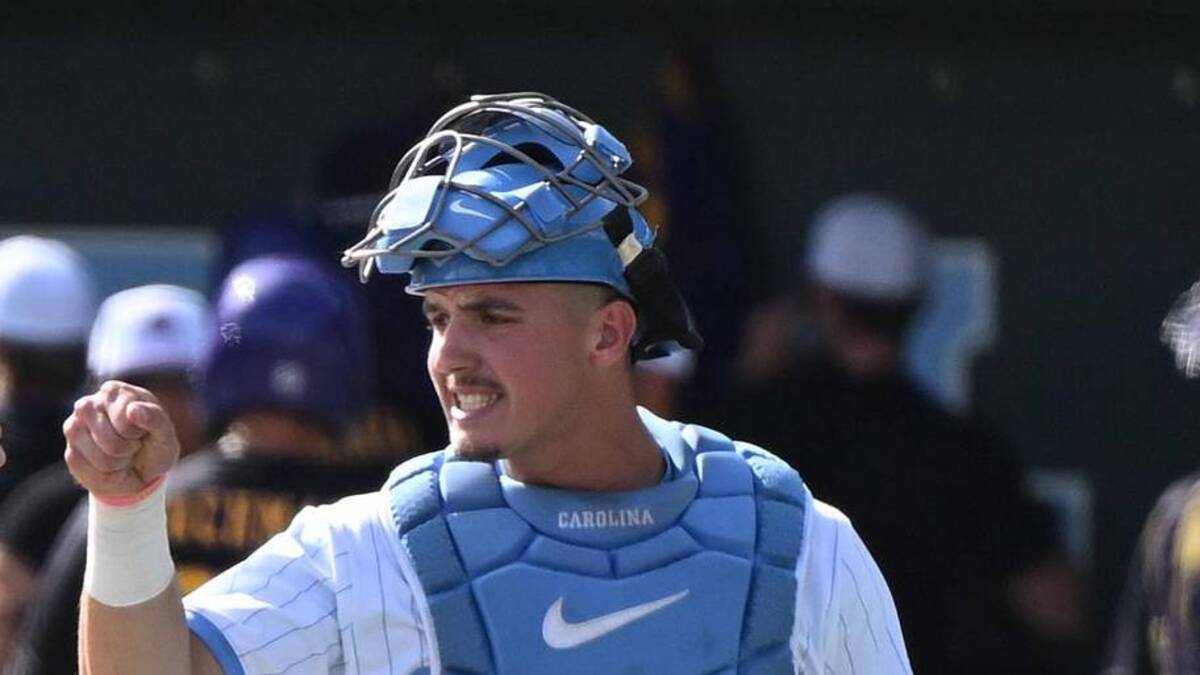 May 31, 2026; Chapel Hill, NC, USA; North Carolina Tar Heels pitcher Folger Boaz (36) fist bumps catcher Colin Hynek (23) after the first inning against the East Carolina Pirates during the Chapel Hill Regional at Boshamer Stadium. Mandatory Credit: William Howard-Imagn Images | William Howard-Imagn Images 