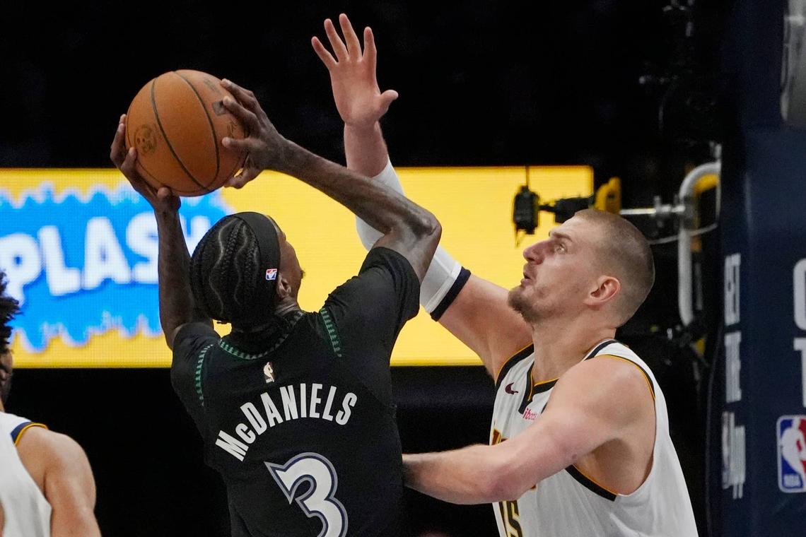  Minnesota Timberwolves forward Jaden McDaniels (3) shoots against Denver Nuggets center Nikola Jokic (15) in the fourth quarter at Target Center Bruce Kluckhohn-Imagn Images
