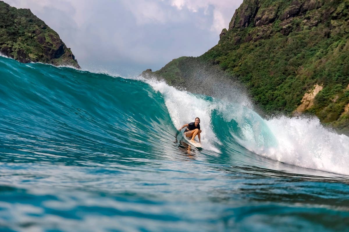  A well-known surf break along a coastline where saltwater crocodiles are.