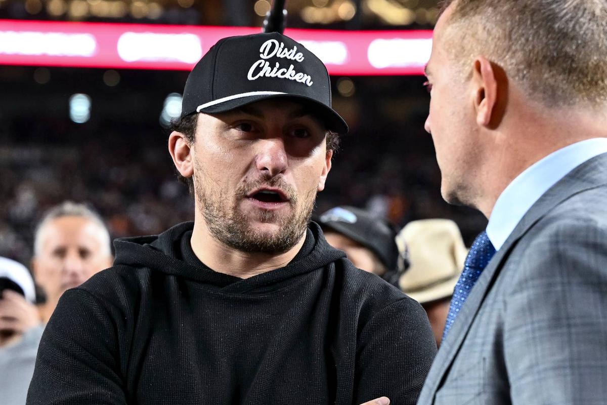  Nov 30, 2024; College Station, Texas, USA; Former Texas A&M and Cleveland Browns quarterback Johnny Manziel speaks with ESPN's College GameDay analyst Kirk Herbstreit prior to the game against the Texas Longhorns. The Longhorns defeated the Aggies 17-7 at Kyle Field. Mandatory Credit: Maria Lysaker-Imagn Images 