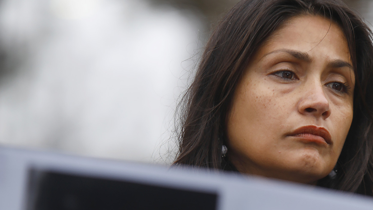 Esmeralda Cantu-Castle, mother of murdered Navy sailor Angelina Resendiz, stands behind a placard of others who suffered the same violence as her daughter during a press conference at Naval Station Norfolk on Friday, Feb. 20, 2026. (Stephen M. Katz/The Virginian-Pilot/TNS)