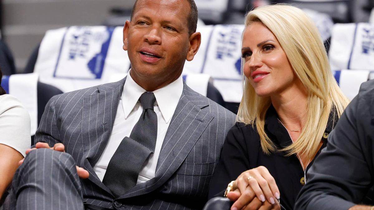 Former baseball player Alex Rodriguez sits court-side with Jaclyn Cordeiro before Game Seven of the Western Conference Second Round Playoffs between the Minnesota Timberwolves and the Denver Nuggets at Ball Arena on May 19, 2024, in Denver, Colorado.