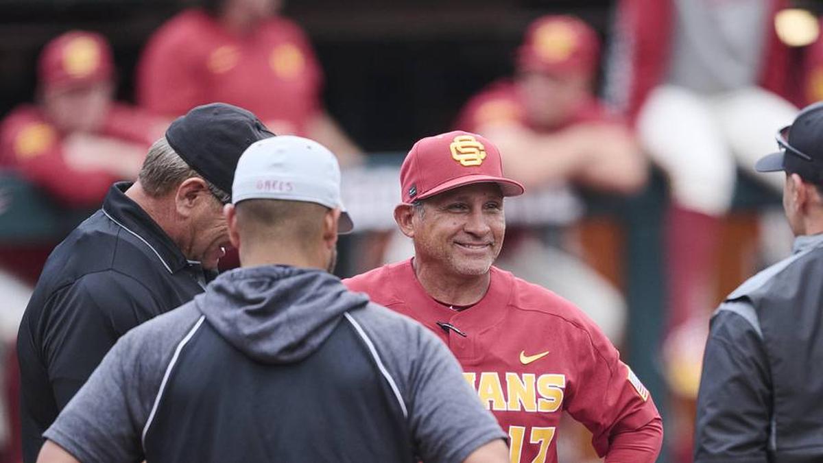  May 31, 2025; Corvallis, OR, USA; USC head coach Andy Stankiewicz visits with official before a game against Saint Mary's at the NCAA Corvallis Regional at Goss Stadium. | Troy Wayrynen-Imagn Images 
