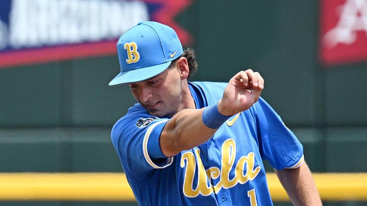  Jun 14, 2025; Omaha, Neb, USA; UCLA Bruins shortstop Roch Cholowsky (1) completes a double play as Murray State Racers left fielder Dan Tauken (37) is out at second base during the second inning at Charles Schwab Field. Mandatory Credit: Steven Branscombe-Imagn Images | Steven Branscombe-Imagn Images 