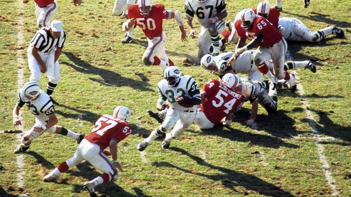  Oct 5, 1969; Boston, MA, USA; FILE PHOTO; New York Jets running back Emerson Boozer (32) carries the ball as he is pursued by Boston Patriots linebacker John Bramlett (57) at Harvard Stadium. Mandatory Credit: Dick Raphael-Imagn Images | Dick Raphael-Imagn Images 