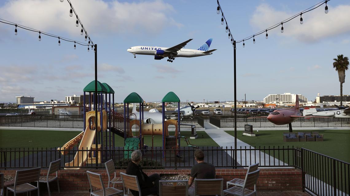 FAA Targets 40 “High-Volume” US Airports For Flight Cuts Amid Government Shutdown. A United Airlines plane descends to land at Los Angeles International Airport (LAX) as people watch from a nearby park featuring old aircraft on November 6, 2025 in Los Angeles, California. 