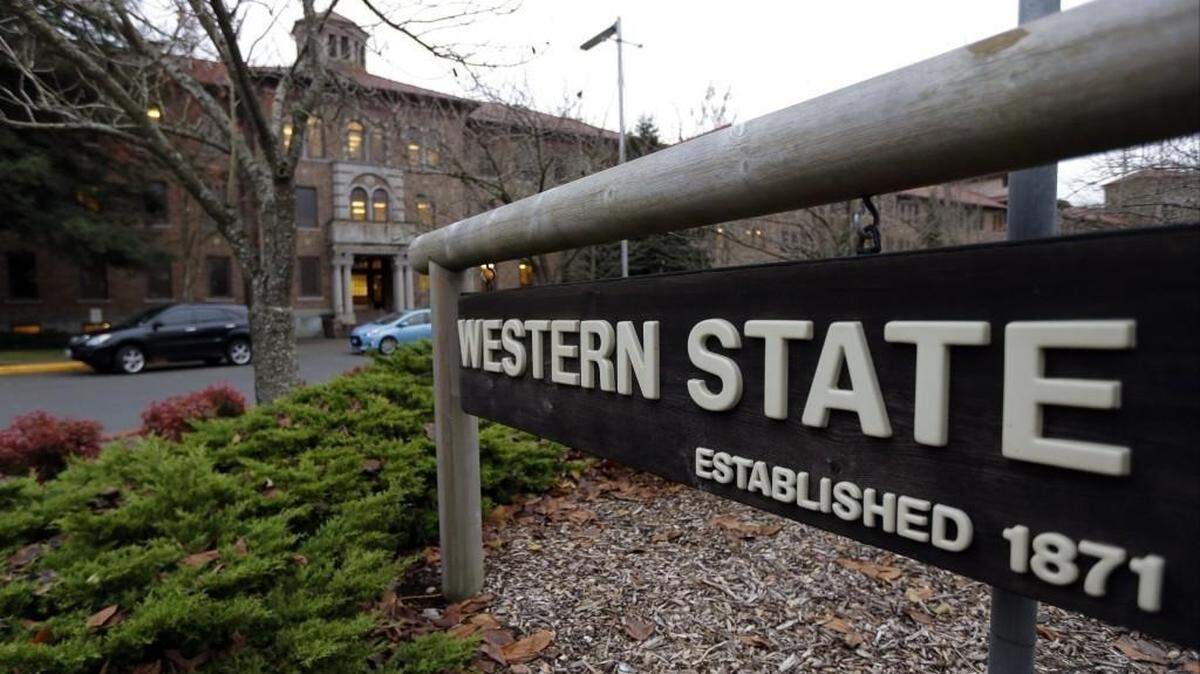 FILE - This Nov. 18, 2015, file photo shows a sign near the main entrance of Western State Hospital, the largest psychiatric hospital in the state, in Lakewood, Wash. Washington Gov. Jay Inslee on Tuesday, April 12, 2016, fired the head of a the state psychiatric hospital after an accused murderer escaped from the hospital last week. (AP Photo/Ted S. Warren, File)