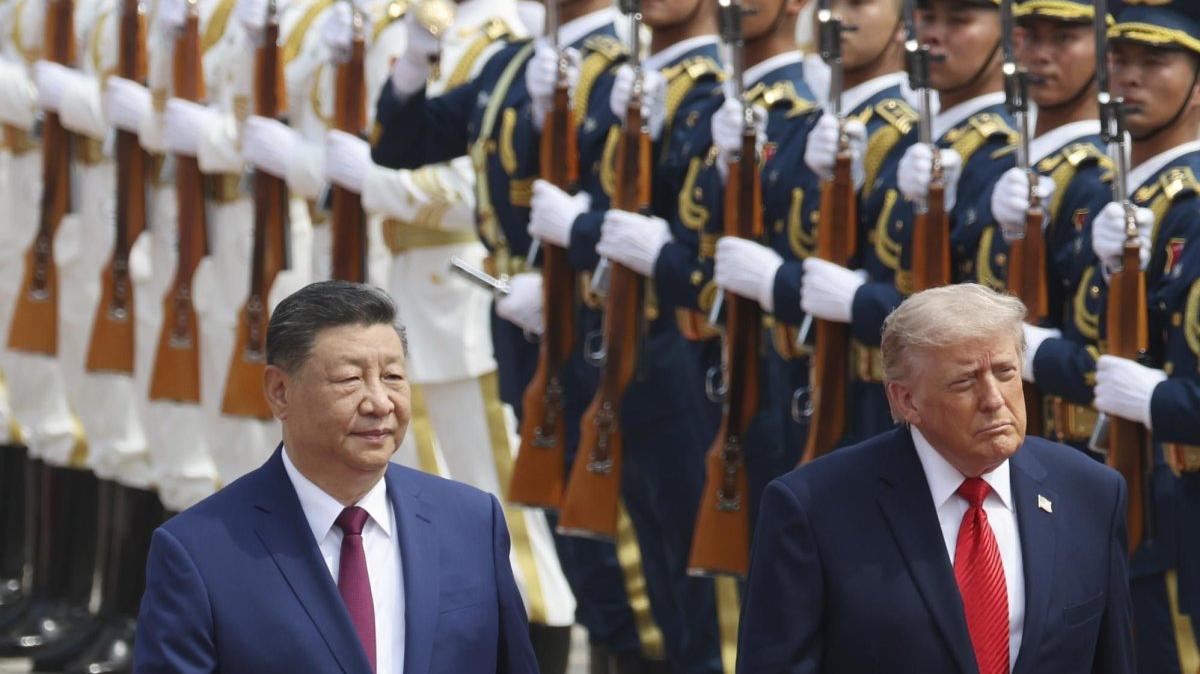 Chinese President Xi Jinping inspects an honor guard with U.S. President Donald Trump during a welcome ceremony at the Great Hall of the People in Beijing, China, on Thursday. Trump is in China for a two-day visit, his first since 2017, to discuss trade, technology and security issues. Pool Photo by Maxim Shemetov/EPA