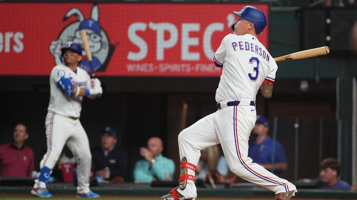 Rangers hold off Astros after erupting for 8 runs in first inning 