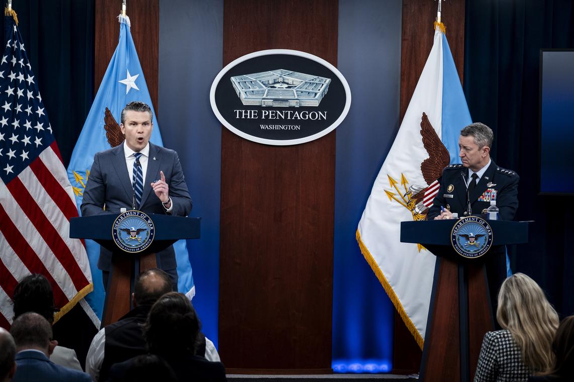 Secretary of Defense Pete Hegseth, left, and Chairman of the Joint Chiefs of Staff Gen. Dan Caine, right, provide updates on the war in Iran at the Pentagon in Arlington, Va., Thursday, April 16, 2026. (Pete Marovich/The New York Times)