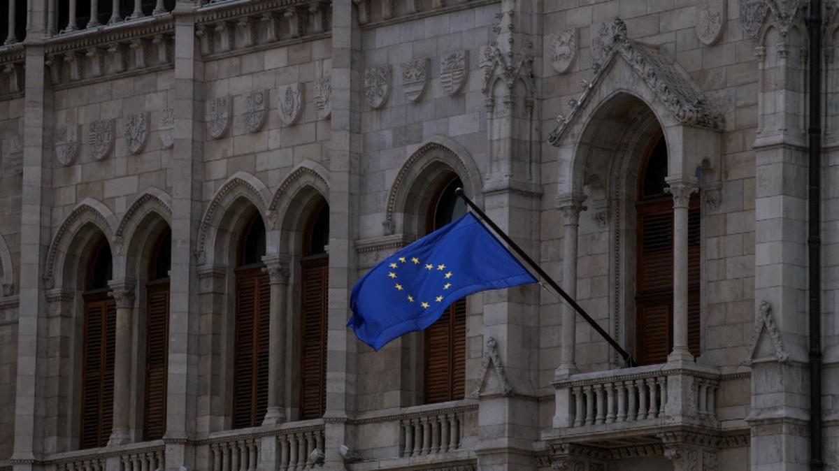 A flag of the European Union flutters from the facade of the Hungarian Parliament, on the day Prime Minister-elect Peter Magyar takes his oath of office and the inaugural session of the parliament, in Budapest, Hungary, May 9, 2026. REUTERS/Leonhard Foeger