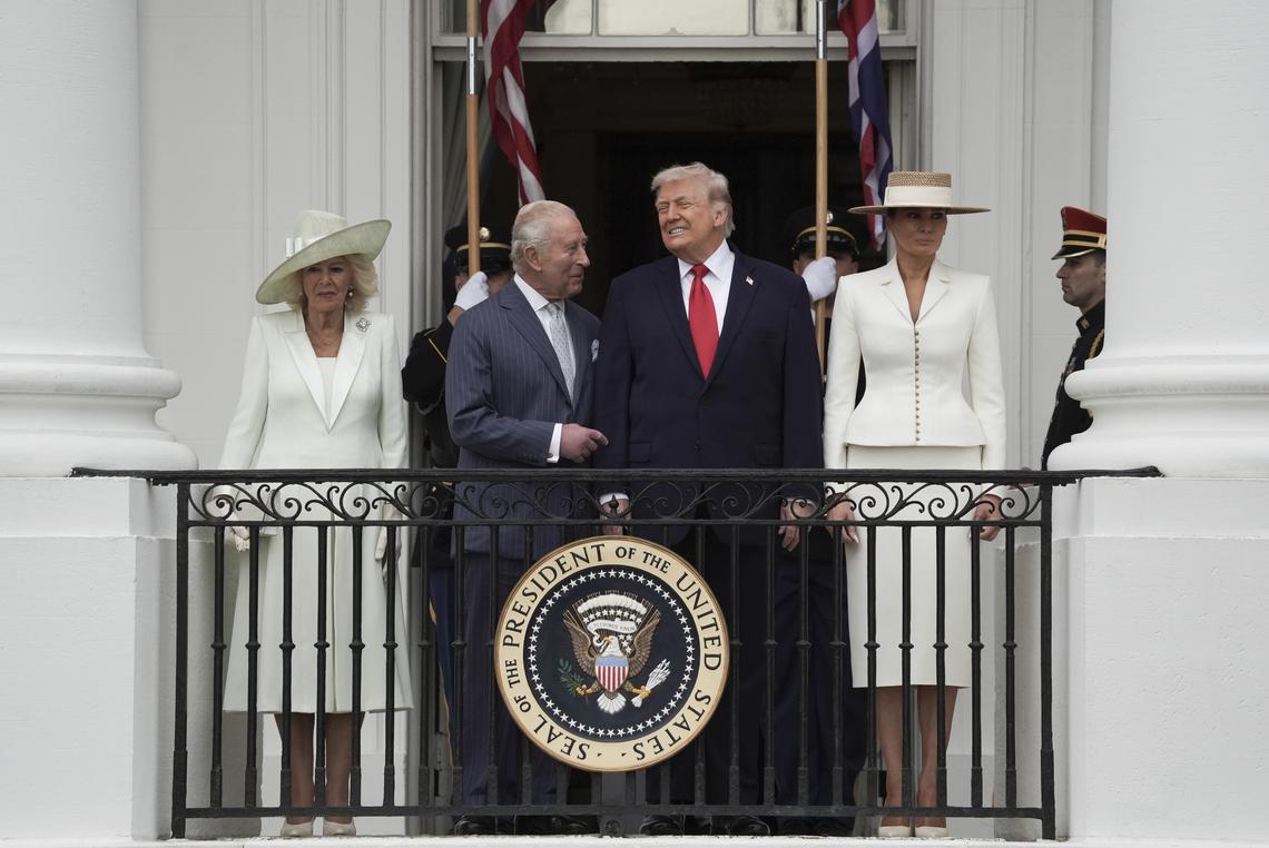 From right: first lady Melania Trump, President Donald Trump, King Charles III, and Queen Camilla watch a pass in review from a balcony of the White House during an arrival ceremony in Washington, on Tuesday, April 28, 2026. (Salwan Georges/The New York Times)