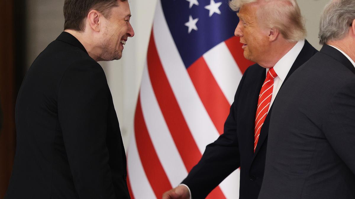 U.S. President Donald J. Trump greets Tesla CEO Elon Musk before a state dinner at the Lusail Palace on May 14, 2025, in Doha, Qatar.