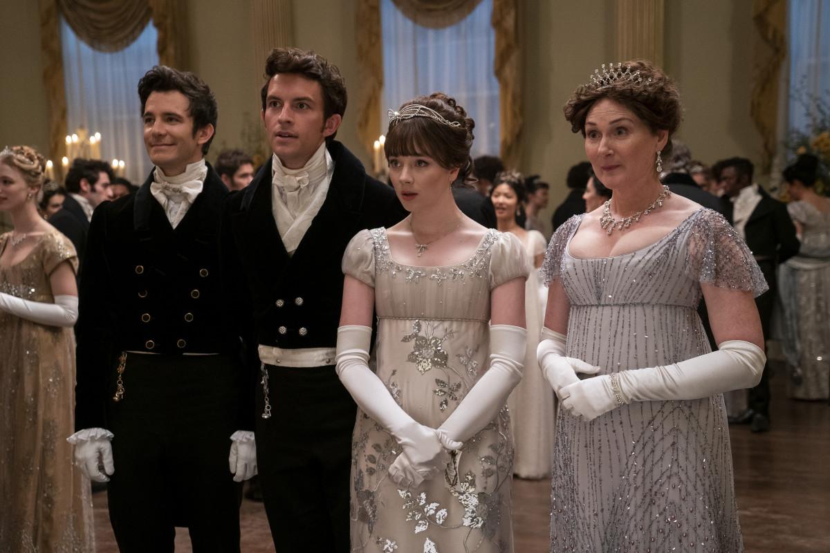 Luke Thompson as Benedict Bridgerton, left, Jonathan Bailey as Anthony Bridgerton, Claudia Jessie as Eloise Bridgerton, Ruth Gemmell as Lady Violet Bridgerton in episode 201 of Bridgerton. 