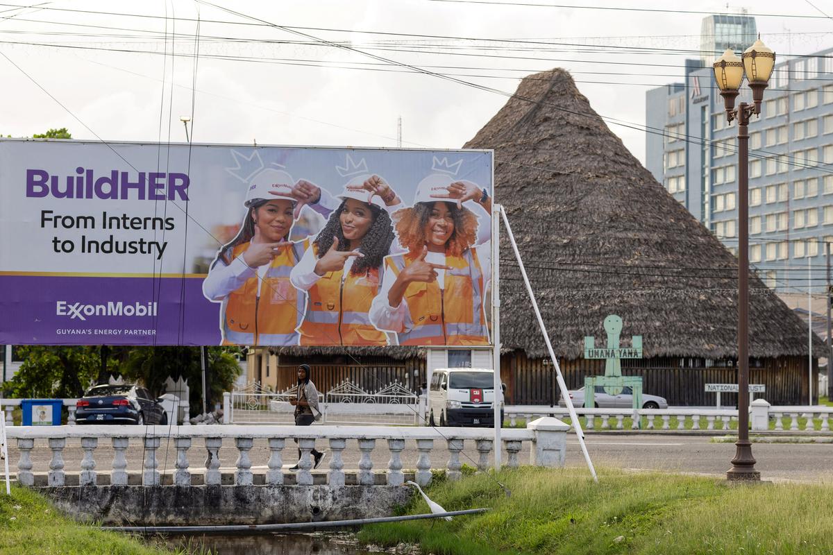 A billboard for ExxonMobil promoting women in the workforce stands in the Kingston neighborhood, as Guyana's fast-growing economy is set to benefit from a reshaped global energy market due to the U.S.-Israeli war on Iran, in Georgetown, Guyana May 9, 2026. REUTERS/Yancey Haywood