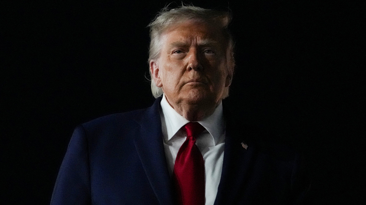 U.S. President Donald Trump looks on, as he returns after attending Game 3 of the NBA Finals, at John F. Kennedy International Airport in New York, U.S., June 8, 2026. REUTERS/Nathan Howard