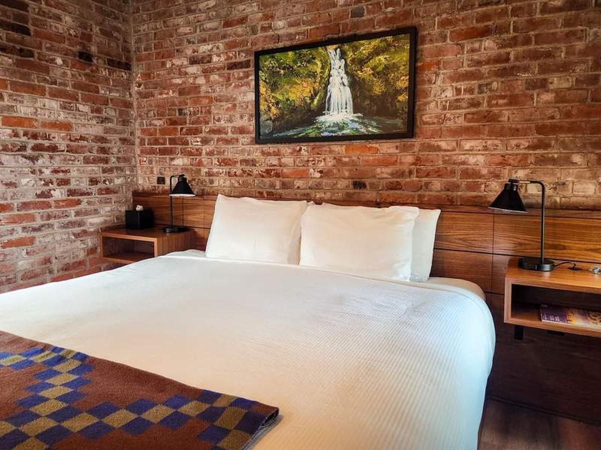  Vintage brick walls and beadboard wainscoting give this guest room at Lightwell Hotel and Spa a yesteryear feel. Photo credit: June Russell-Chamberlin 