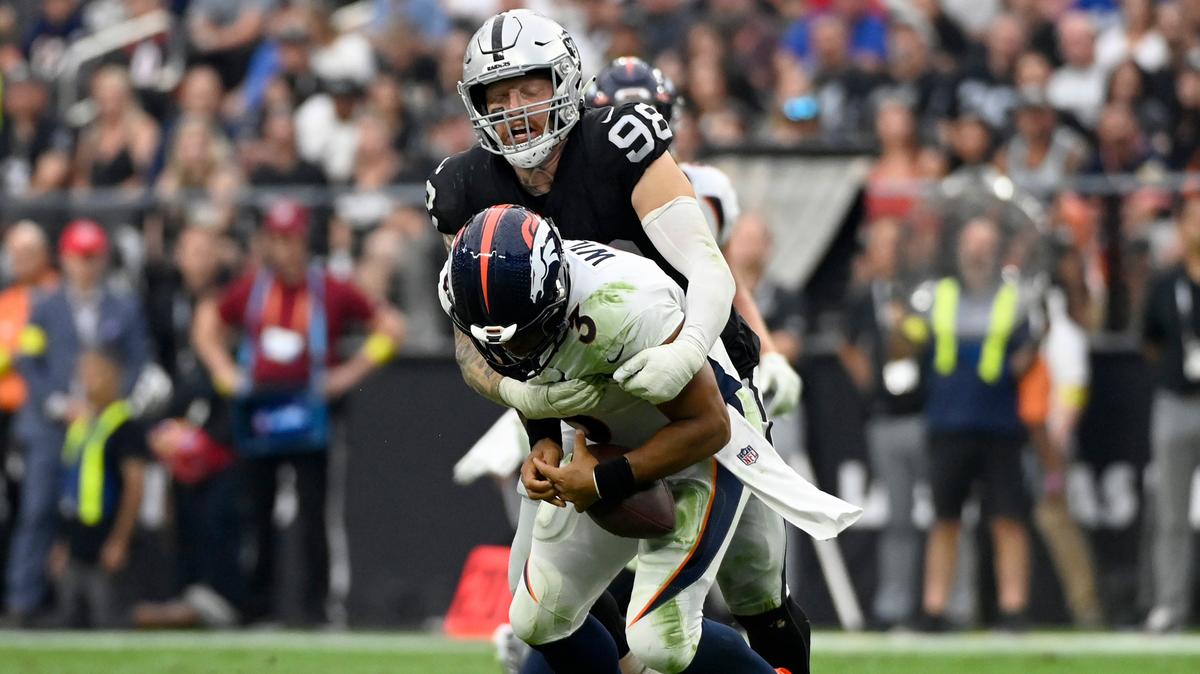 Las Vegas Raiders defensive end Maxx Crosby (98) sacks Denver Broncos quarterback Russell Wilson (3) during the second half of an NFL football game, Sunday, Oct. 2, 2022, in Las Vegas. (AP Photo/David Becker)