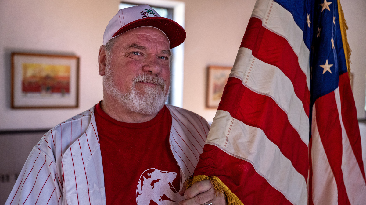 Flag Man marched around Philadelphia's Veterans Stadium after 9/11. 25 years later, he's better for it