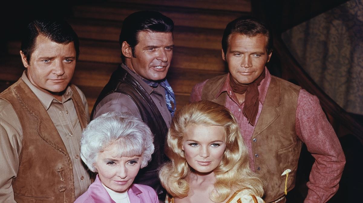 (Original Caption) Group shot of the cast of the ABC Western, The Big Valley. From top right (clockwise): Lee Majors, Linda Evans, Barbara Stanwyck, Richard Long, and Peter Breck.