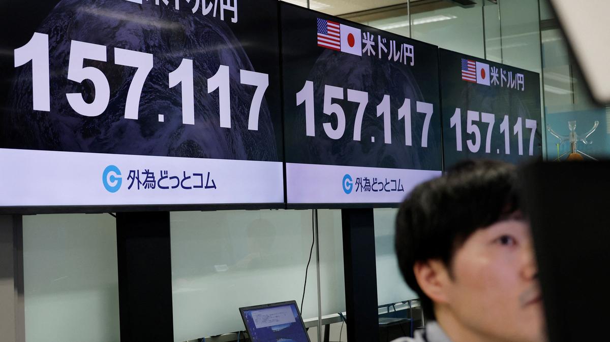 An employee of the foreign exchange trading company Gaitame.com works in front of monitors displaying the current Japanese yen exchange rate against the U.S. dollar, at their dealing room in Tokyo, Japan May 1, 2026. REUTERS/Kim Kyung-Hoon