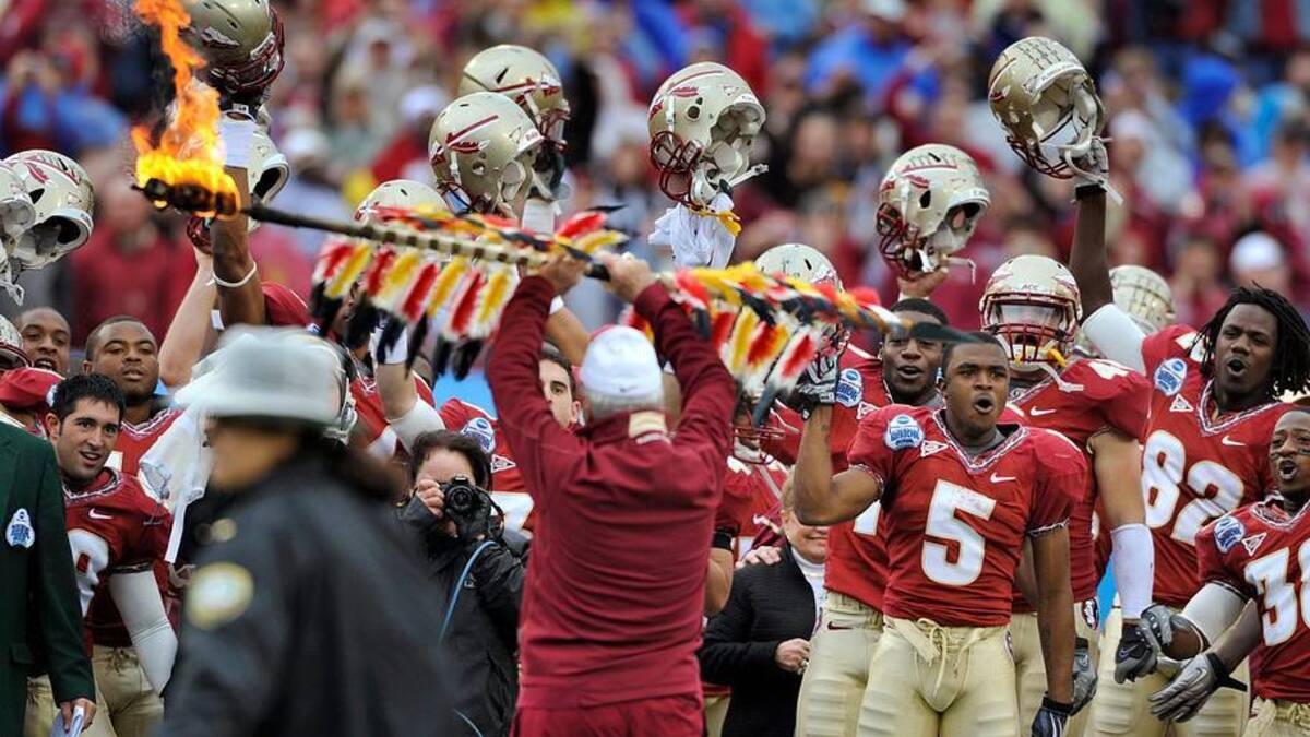  BOB SELF/The Times-Union-1/1/10--FSU head coach Bobby Bowden holds Osceola's burning spear aloft before planting it into the truf in front of his players before the start of Friday's Gator Bowl game which saw the Seminoles winning with a final score of 33 to 21. First half action had WVU leading FSU 14 to 13. Seminole Head Football Coach Bobby Bowden made a grand entrance to the stadium Friday morning with his team despite the cold rain. Friday Florida State University took on West Virginia | USA TODAY Network via Reuters Connect 