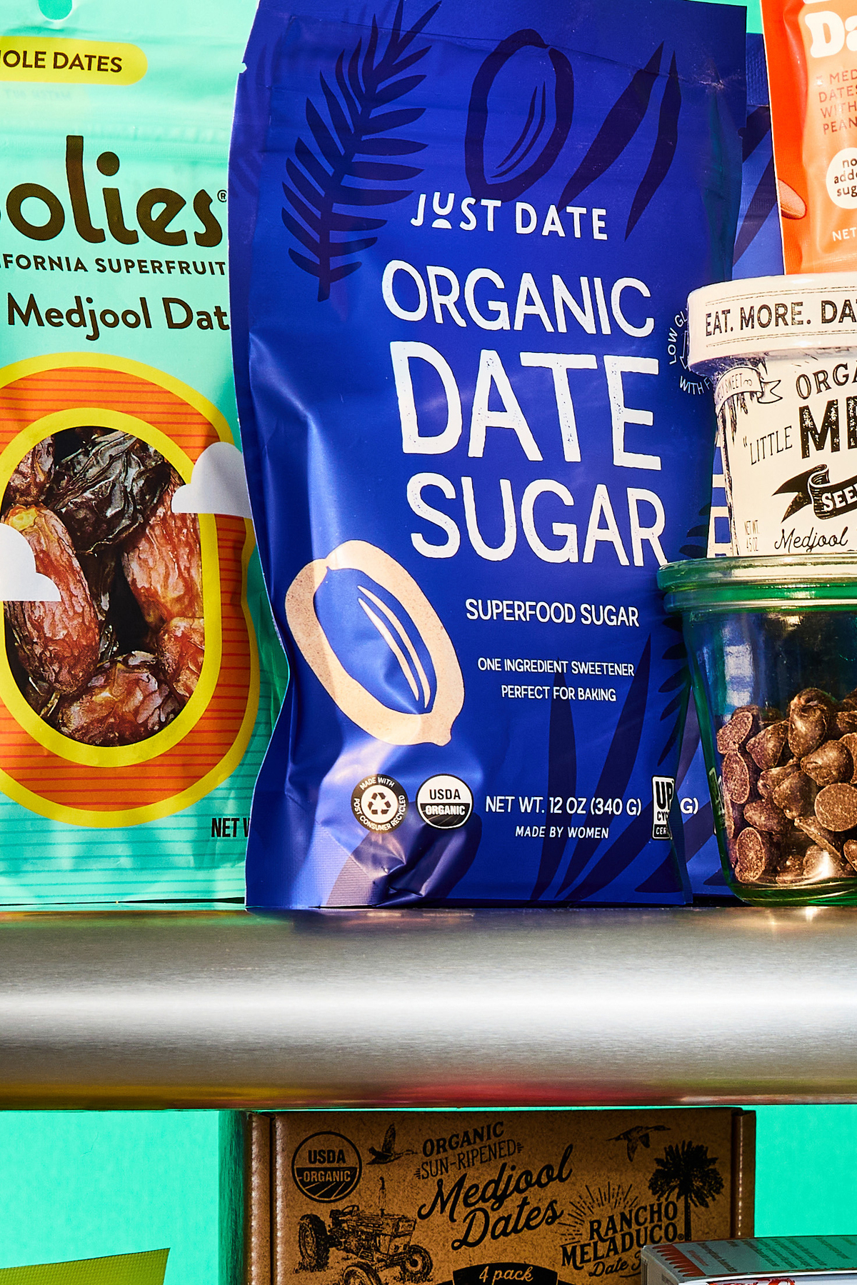 Snack foods and other food products based on dates are displayed for a photograph in New York on May 26, 2026. At the supermarket, you can find dates stuffed and dipped, blended into protein bars, transformed into alternative sweeteners and chocolate chips, and, of course, whole and unadulterated. Prop Stylist: JoJo Li. (Julia Gartland/The New York Times)