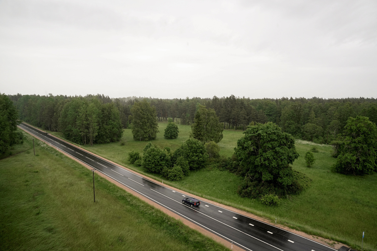 A car travels on a road in Atasiene parish, in Latvia, June 8, 2026. REUTERS/Janis Laizans