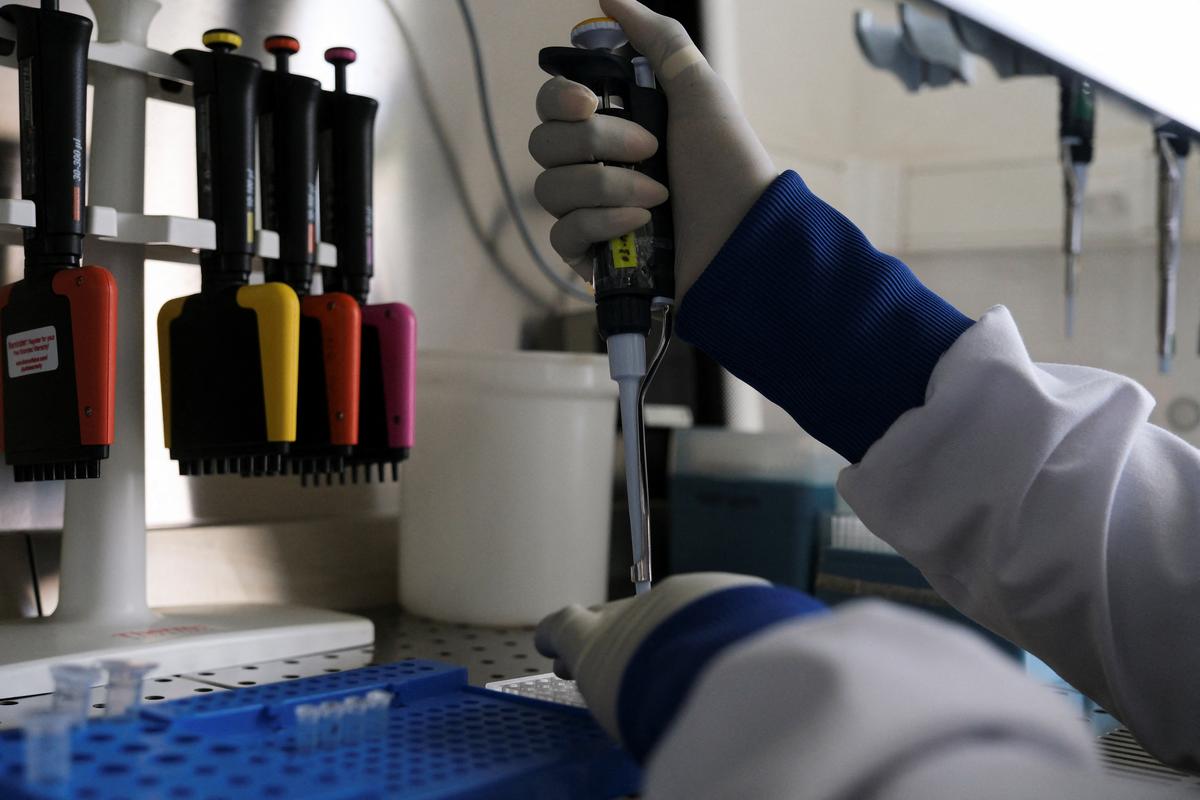 Seynabou Diop works at a station in a laboratory where the hantavirus genome was sequenced from the April 2026 outbreak, at Institut Pasteur in Dakar, Senegal, May 19, 2026. REUTERS/Ricci Shryock
