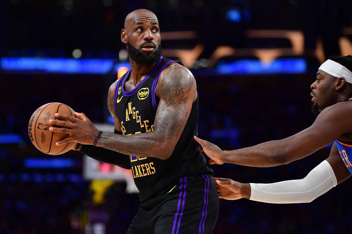  Los Angeles Lakers forward LeBron James controls the ball as Oklahoma City Thunder guard Lu Dort defends during their playoff game at Crypto.com Arena on May 11, 2026. Gary A. Vasquez-Imagn Images
