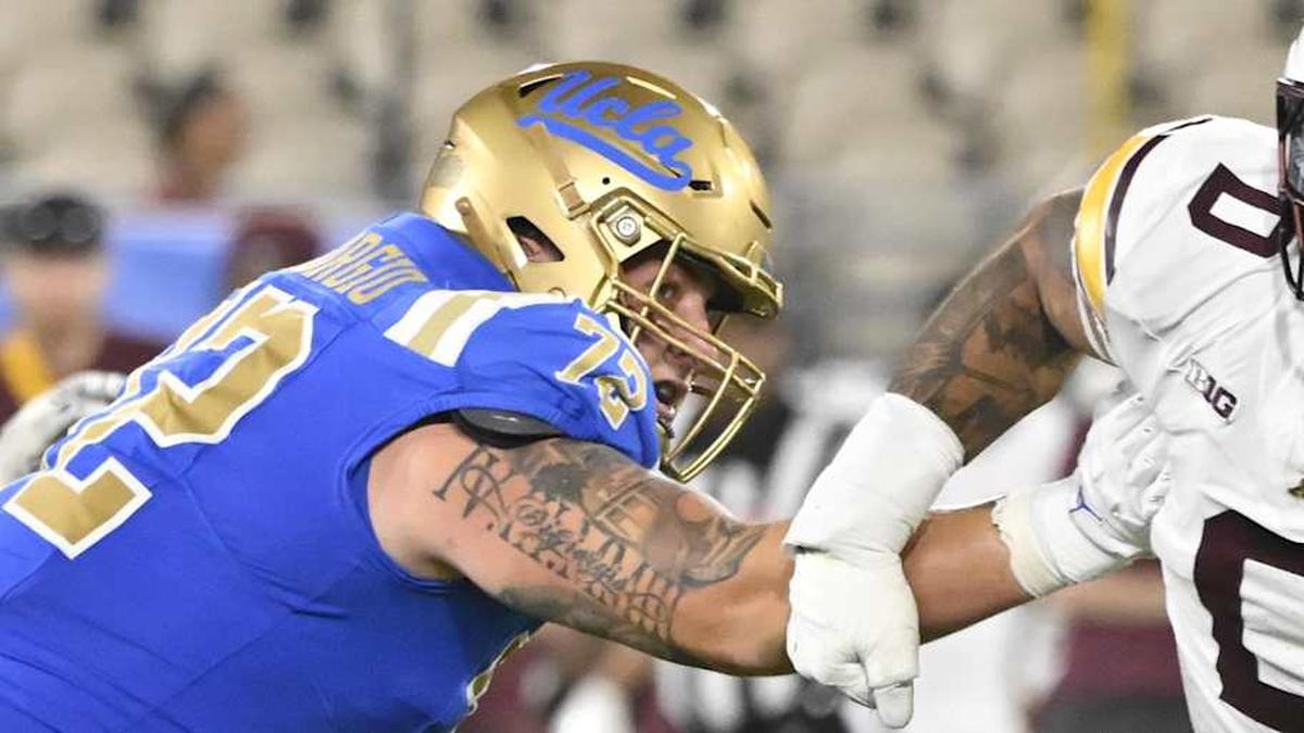  Oct 12, 2024; Pasadena, California, USA; Minnesota Golden Gophers defensive lineman Anthony Smith (0) pressures UCLA Bruins quarterback Ethan Garbers (4) as offensive lineman Garrett DiGiorgio (72) blocks during the second quarter at Rose Bowl. Mandatory Credit: Robert Hanashiro-Imagn Images | Robert Hanashiro-Imagn Images 