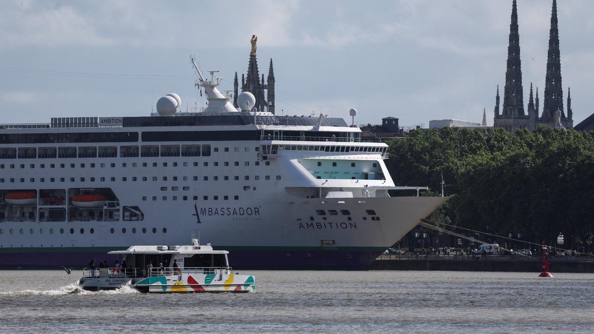 Cruise ship Ambition, operated by the Ambassador Cruise Line, is docked at the Port of Bordeaux after local authorities said passengers could not disembark following an outbreak of possible gastroenteritis reported on board, in Bordeaux, France, May 13, 2026. REUTERS/Stephane Mahe