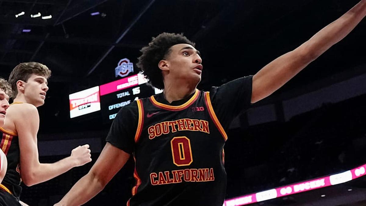  USC Trojans guard Alijah Arenas (0) reaches for a rebound in front of Ohio State Buckeyes center Christoph Tilly (13) and center Gabe Dynes (45) during the second half of the NCAA men's basketball game at the Schottenstein Center on Feb. 11, 2026. Ohio State won 89-82. | Adam Cairns/Columbus Dispatch / USA TODAY NETWORK via Imagn Images 