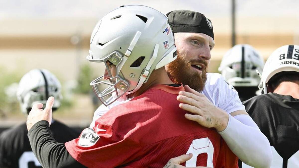  Jun 3, 2026; Henderson, NV, USA; Las Vegas Raiders defensive end Maxx Crosby (98) hugs quarterback Kirk Cousins (8) during organized team activities at Intermountain Health Performance Center. Mandatory Credit: Candice Ward-Imagn Images | Candice Ward-Imagn Images 