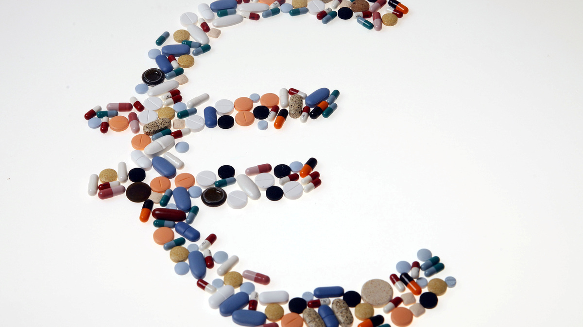 Pharmaceutical tablets and capsules are arranged in the shape of a Euro currency sign on a table in this picture illustration, August 20, 2014. REUTERS/Srdjan Zivulovic/Illustration