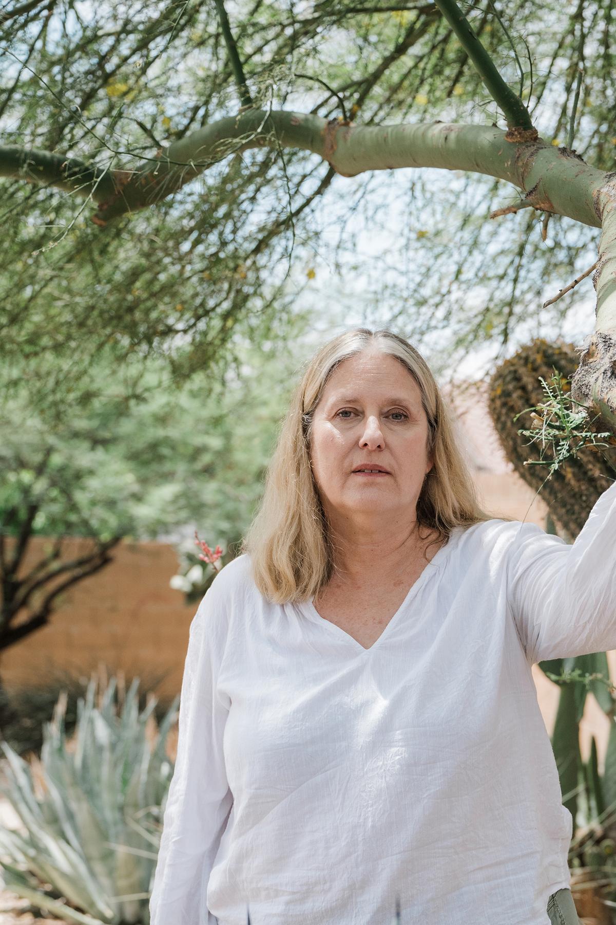 Cynthia Sloan, who said that she learned of her layoff from Oracle through a generic email that arrived at 3 in the morning, at her home in Scottsdale, Ariz., May 13, 2026. The website Blind -- where professionals share advice, and gallows humor, anonymously -- is chronicling the curdling of tech optimism. (Caitlin O'Hara/The New York Times)