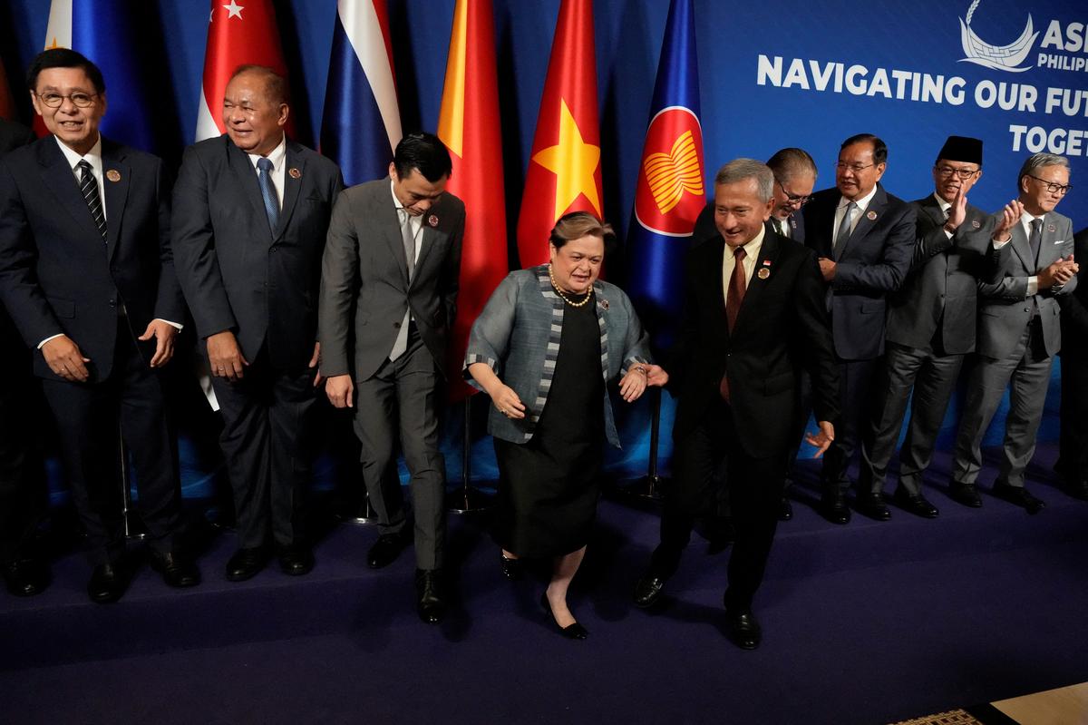 Thailand's Foreign Minister Sihasak Phuangketkeow, East Timor's Foreign Minister Bendito dos Santos Freitas, Vietnam's Deputy Minister of Foreign Affairs Dang Hoang Giang, Philippine’s Foreign Secretary Theresa Lazaro, Singapore's Foreign Minister Vivian Balakrishnan, Brunei's Second Foreign Minister Erywan Pehin Yusof, Cambodia's Foreign Minister Prak Sokhonn and Indonesia's Foreign Minister Sugiono, leave the stage after the group photo session at the ASEAN Foreign Ministers’ Meeting ahead of the 48th ASEAN Summit and Related Meetings in Cebu City, Philippines, May 7, 2026. Aaron Favila/Pool via REUTERS