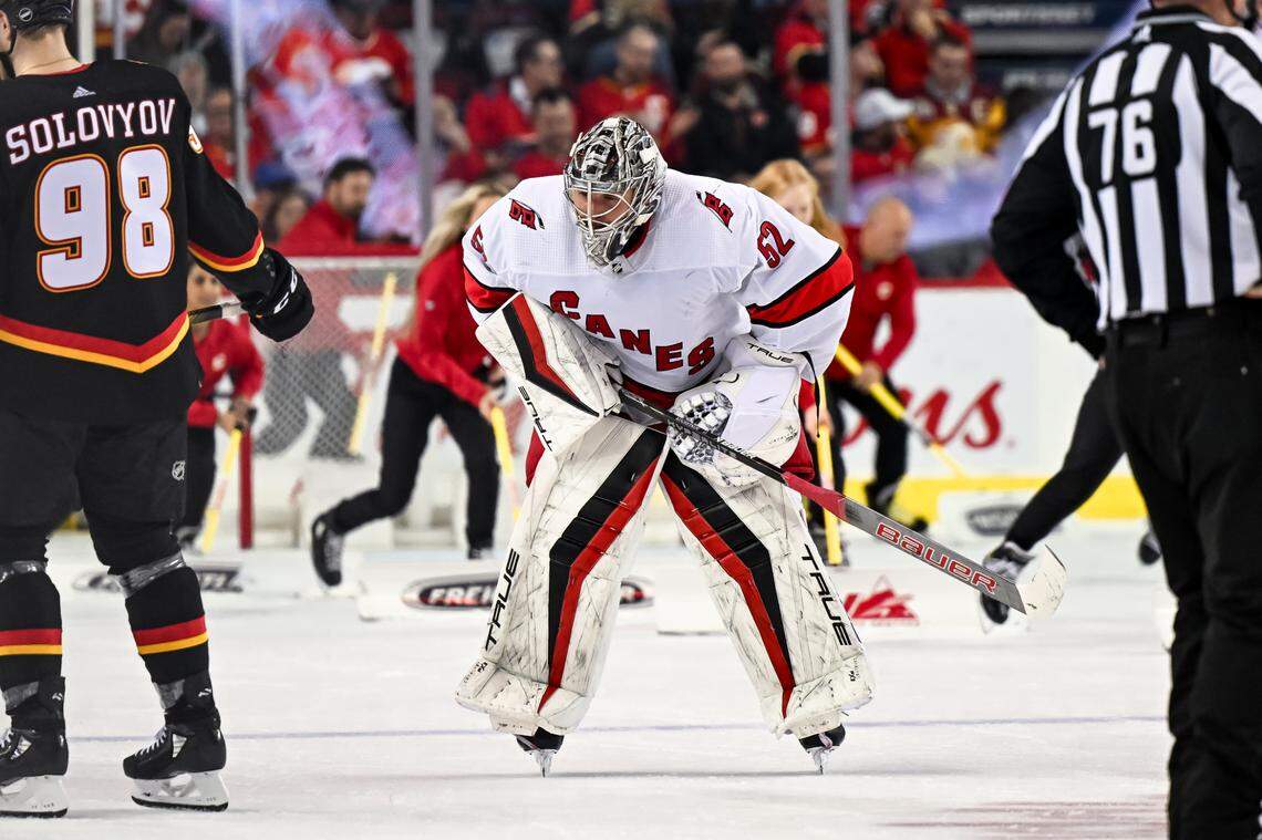 Dec 7, 2023; Calgary, Alberta, CAN; Carolina Hurricanes goaltender Pyotr Kochetkov (52) skates to the bench after a stoppage in play during the second period of a game at Scotiabank Saddledome. Mandatory Credit: Brett Holmes-USA TODAY Sports