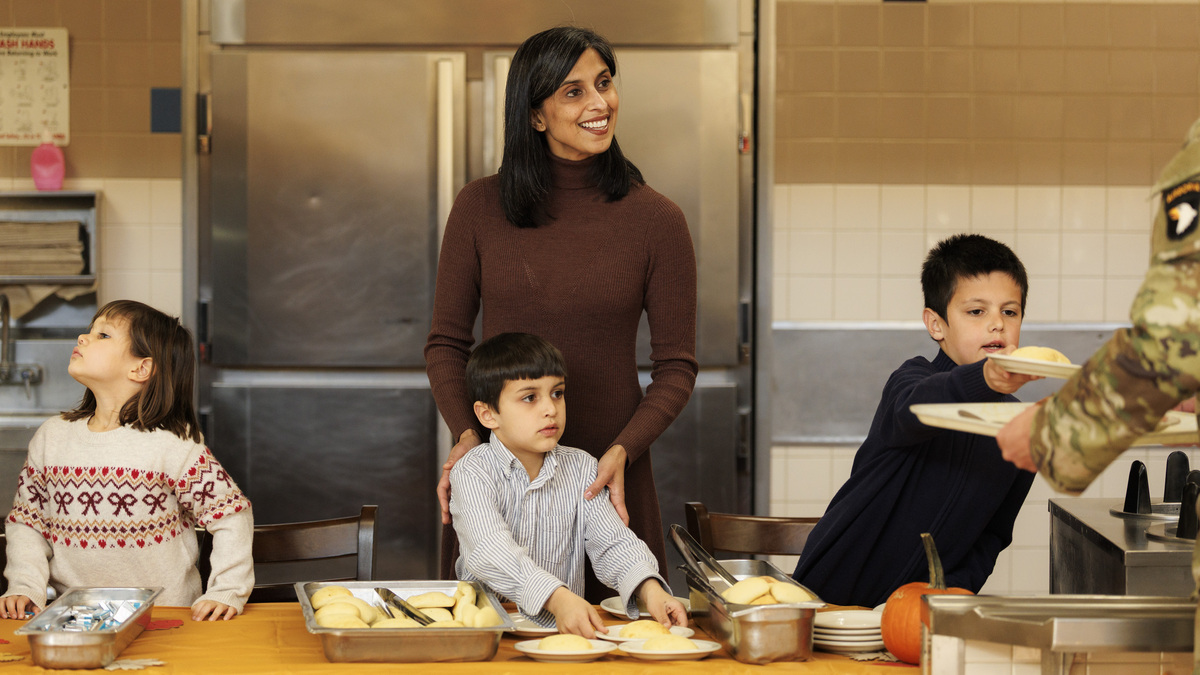 Second lady Usha Vance and children serve food to members of the 101st Airborne Division on Nov. 26, 2025, in Fort Campbell, Tennessee. Vice President JD Vance made the trip to Fort Campbell with his family to serve an early Thanksgiving with service members. (Brett Carlsen/Getty Images/TNS)