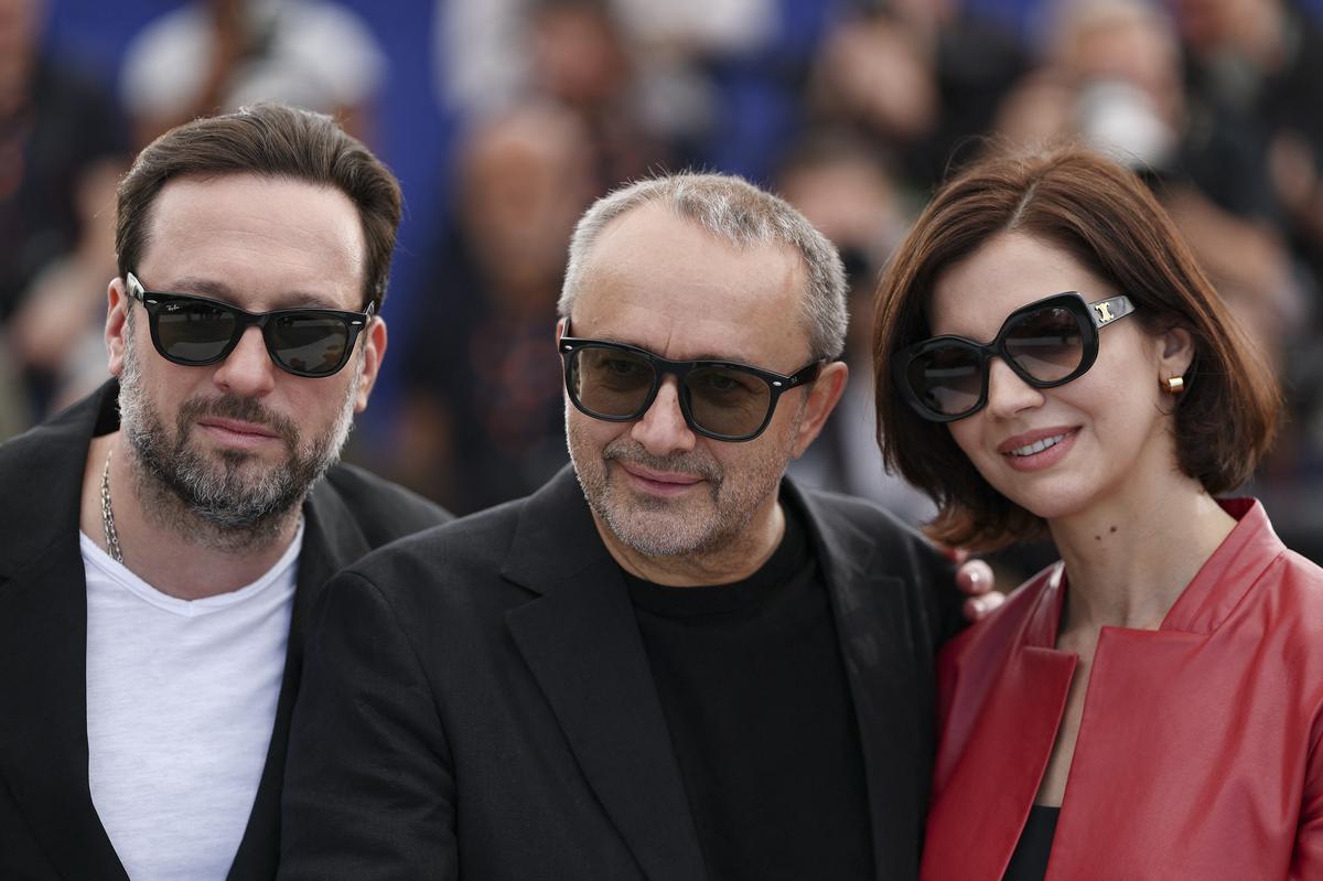 Director Andrey Zvyagintsev and cast members Iris Lebedeva and Dmitriy Mazurov pose during a photocall for the film "Minotaur" (Minotaure) in competition at the 79th Cannes Film Festival in Cannes, France, May 20, 2026. REUTERS/Gonzalo Fuentes
