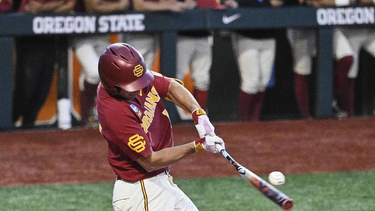  May 31, 2025; Corvallis, OR, USA; USC outfielder Jack Basseer (14) hits the ball during the eighth inning against Saint Mary's at the NCAA Corvallis Regional at Goss Stadium. Mandatory Credit: Troy Wayrynen-Imagn Images | Troy Wayrynen-Imagn Images 