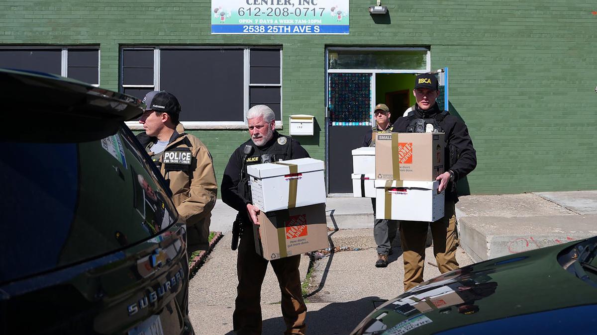 FBI and law enforcement agents carry boxes to waiting SUVs as they raid the Mako Childcare Center on April 28, 2026, in south Minneapolis. The Mako Childcare Center was one of 22 sites targeted Tuesday morning as part of a fraud probe in Minnesota. (Anthony Soufflé/The Minnesota Star Tribune/TNS)