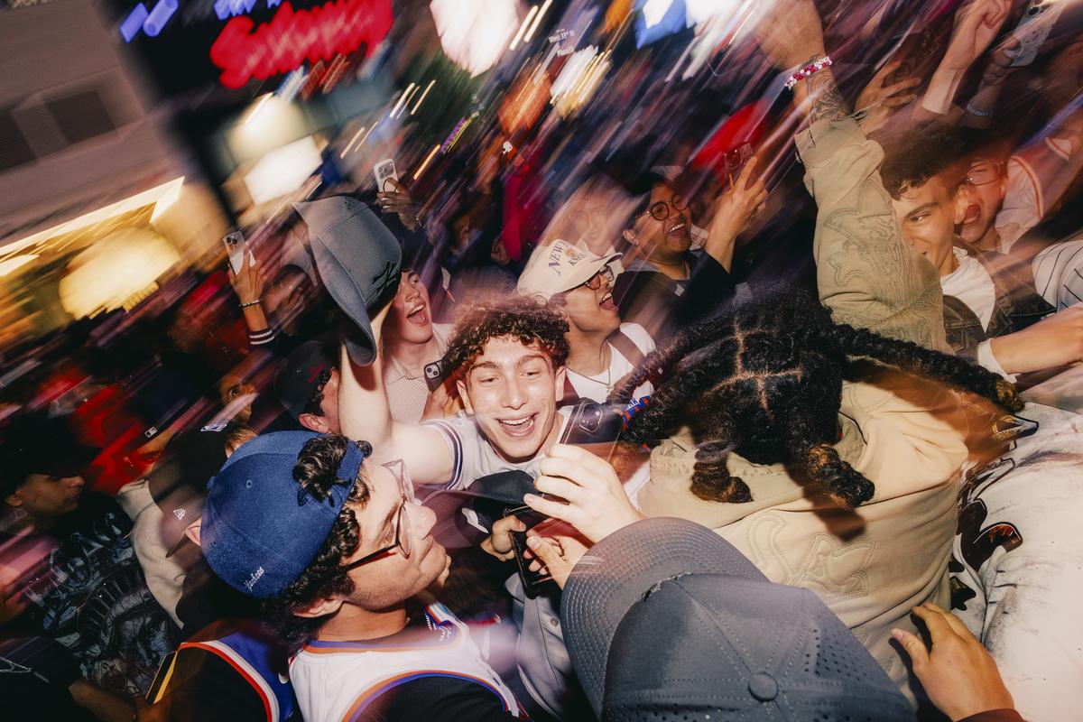 New York Knicks fans celebrate after the team wins Game 2 of the NBA Eastern Conference Finals at a watch party outside Madison Square Garden in New York, May 21, 2026. Fans have been celebrating outside Madison Square Garden as the Knicks appear poised to reach the NBA finals, but the celebrations have grown rowdy, and the city has decided to cancel the crowd-watching parties. (José A. Alvarado Jr./The New York Times)