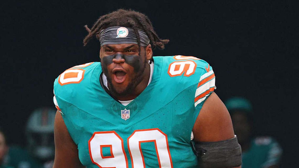  Dec 21, 2025; Miami Gardens, Florida, USA; Miami Dolphins defensive tackle Kenneth Grant (90) enters the field before the game against the Cincinnati Bengals at Hard Rock Stadium. Mandatory Credit: Nathan Ray Seebeck-Imagn Images | Nathan Ray Seebeck-Imagn Images 